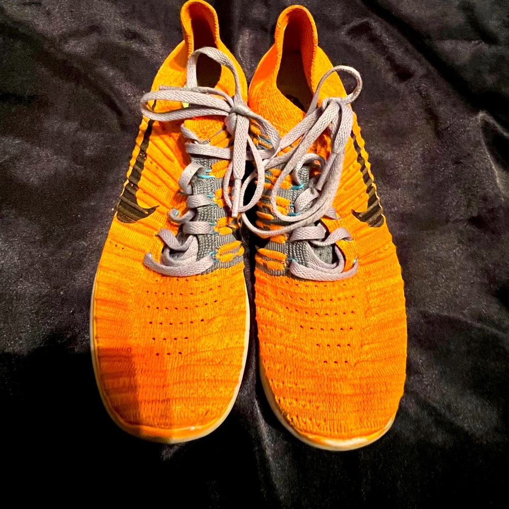 Bright orange women’s size 8 Nike free running shoes